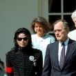 After being honored by the Museum of Children as the "Entertainer of the Decade", President George Bush personally congratulates Michael at the White House.