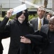 Michael and his children arrive at Los Angeles International Airport.