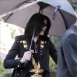 Michael and his children leave the Beverly Hills Hotel