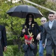 Michael and his children leave the Beverly Hills Hotel