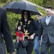Michael and his children leave the Beverly Hills Hotel