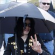 Michael and his children leave the Beverly Hills Hotel