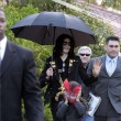 Michael and his children leave the Beverly Hills Hotel