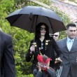 Michael and his children leave the Beverly Hills Hotel