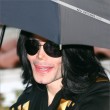 Michael and his children leave the Beverly Hills Hotel