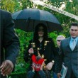 Michael and his children leave the Beverly Hills Hotel