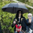 Michael and his children leave the Beverly Hills Hotel