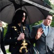 Michael and his children leave the Beverly Hills Hotel