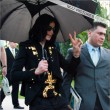 Michael and his children leave the Beverly Hills Hotel