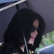 Michael and his children leave the Beverly Hills Hotel