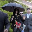 Michael and his children leave the Beverly Hills Hotel