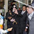 Michael and his children visits Tom's Toys