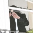 Michael fans from his balcony at the Hempel Hotel in Bayswater London.