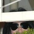 Michael fans from his balcony at the Hempel Hotel in Bayswater London.