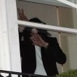 Michael fans from his balcony at the Hempel Hotel in Bayswater London.