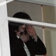 Michael fans from his balcony at the Hempel Hotel in Bayswater London.
