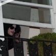 Michael fans from his balcony at the Hempel Hotel in Bayswater London.