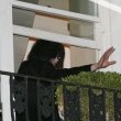 Michael fans from his balcony at the Hempel Hotel in Bayswater London.