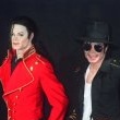 Michael inaugurates a wax statue of himself at the Grevin museum in Paris.