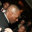 Michael is bombarded by fans at the Carlton Towers in London.