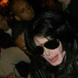 Michael is bombarded by fans at the Carlton Towers in London.