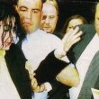 Michael is seen helping an elderly woman after a shopping trip at Harrods.