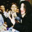 Michael is seen helping an elderly woman after a shopping trip at Harrods.