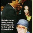 Michael is seen helping an elderly woman after a shopping trip at Harrods.