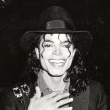 Michael Jackson attends the opening of Donald Trump's Taj Mahal Casino.