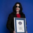 Michael poses with his seven Guinness world records awards.