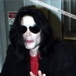 Michael poses with his seven Guinness world records awards.