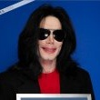 Michael poses with his seven Guinness world records awards.