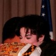 Michael receives an award from the "Thats What Friends Are For" Committee.
