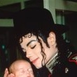 Michael stops and visits children at an Romanian orphanage in 1992 during his 'Dangerous' tour.